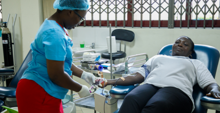 A donor donating blood during Society for AIDS in Africa World AIDS Day Blood Donation Exercise at the National Blood Service Headquarters, Korle Bu, Accra