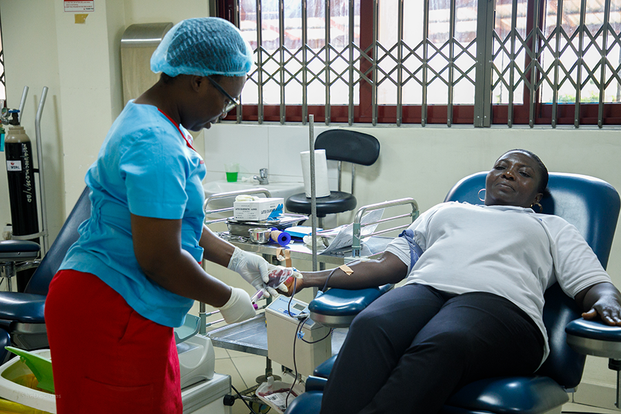A donor donating blood during Society for AIDS in Africa World AIDS Day Blood Donation Exercise at the National Blood Service Headquarters, Korle Bu, Accra