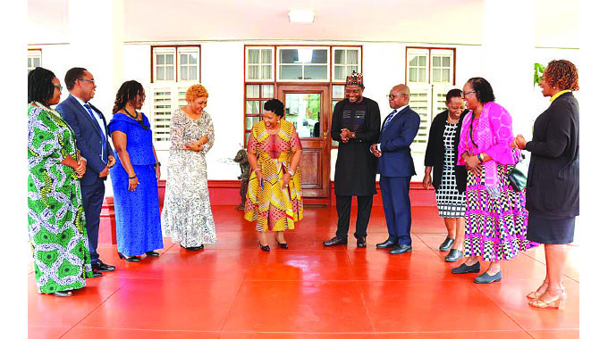 Health and Child Care Ambassador First Lady Dr Auxillia Mnangagwa shares a lighter moment with ICASA local secretariat and UN members after their meeting at Zimbabwe House yesterday.