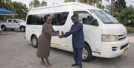 Mrs. Jacqueline Kabambe, chief of HIV/AIDS and Adolescent Development and Participation at UNICEF Zimbabwe presenting the freights of vehicles to Mr. Luc Armand Bodea, ICASA Director