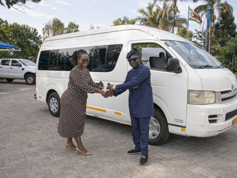 Mrs. Jacqueline Kabambe, chief of HIV/AIDS and Adolescent Development and Participation at UNICEF Zimbabwe presenting the freights of vehicles to Mr. Luc Armand Bodea, ICASA Director