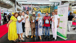 Mr. Luc Armand H. Bodea, ICASA Director/SAA Coordinator, Prof. Sheila Tlou, Board of Trustee; Madam Clemence A. Assogba, Head of Finance/ Admin;Chris K. Nuatro, Partnership/Marketing Officer in a group photograph with some delegates at the SAA booth no. 209, AIDS 2024 Conference.