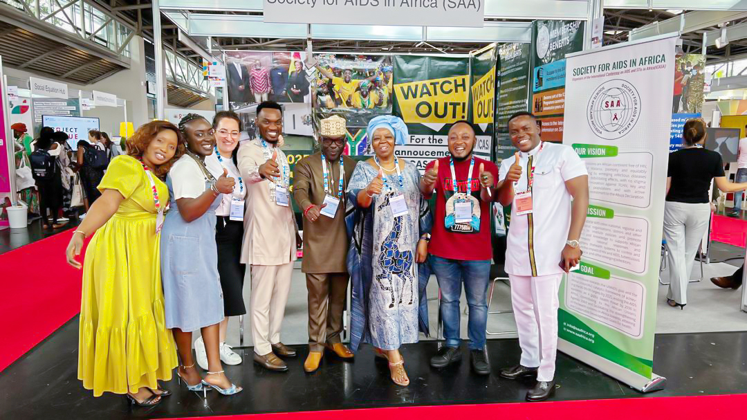 Mr. Luc Armand H. Bodea, ICASA Director/SAA Coordinator, Prof. Sheila Tlou, Board of Trustee; Madam Clemence A. Assogba, Head of Finance/ Admin;Chris K. Nuatro, Partnership/Marketing Officer in a group photograph with some delegates at the SAA booth no. 209, AIDS 2024 Conference.