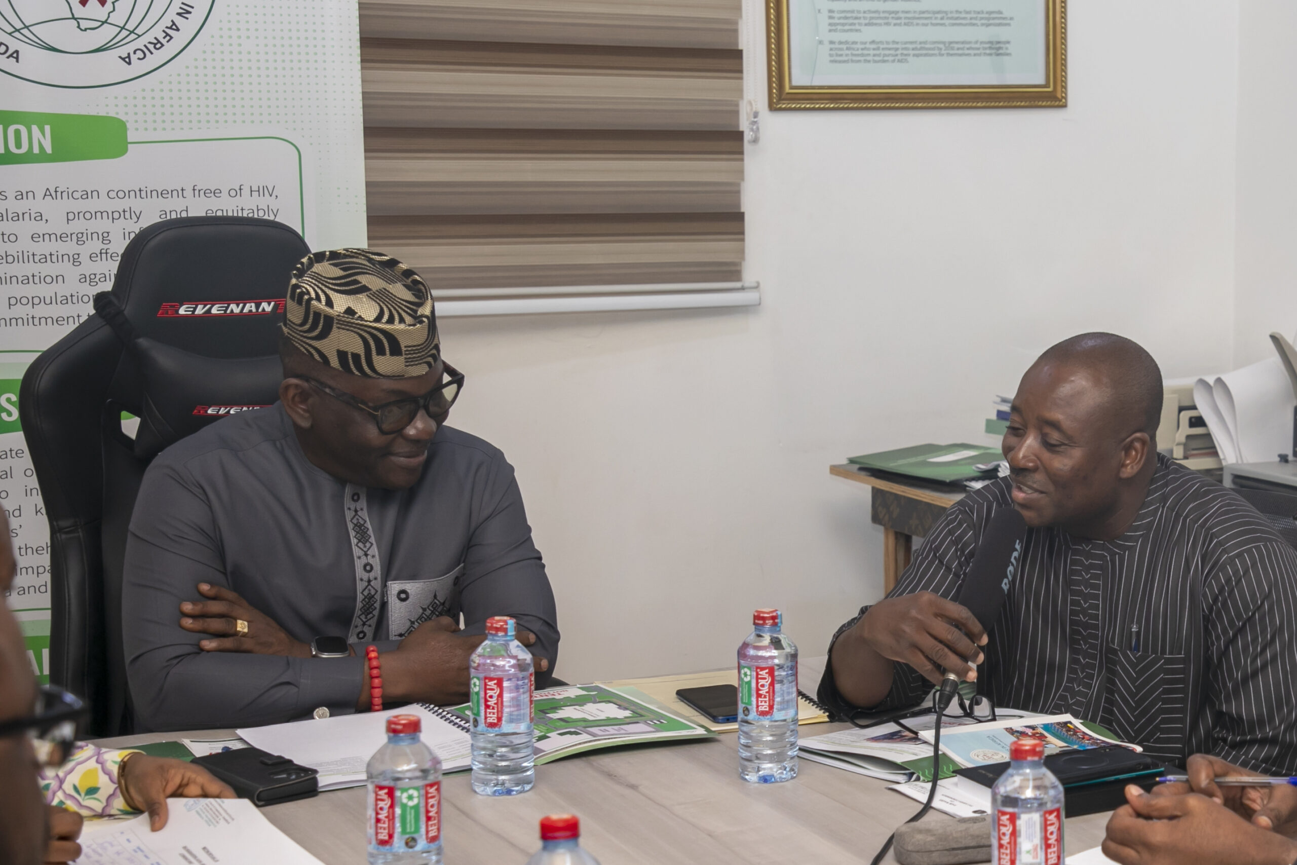 Dr. Kharmacelle Prosper Akanbong, Acting Director General of the Ghana AIDS Commission in a hearty conversation with Mr. Luc Armand Bodea, ICASA Director/SAA Coordinator