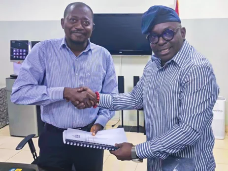 Mr. Luc Armand H. Bodea (SAA/ICASA Director) presenting ICASA 2025 audit and technical report to Dr. Fred Nana Poku (Director of Technical Services, GAC)