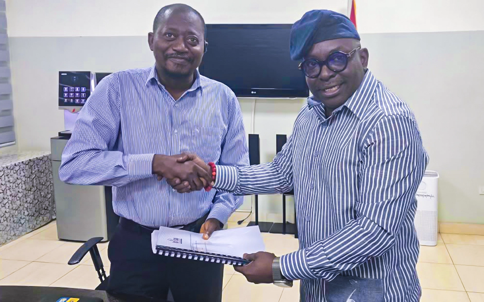 Mr. Luc Armand H. Bodea (SAA/ICASA Director) presenting ICASA 2025 audit and technical report to Dr. Fred Nana Poku (Director of Technical Services, GAC)