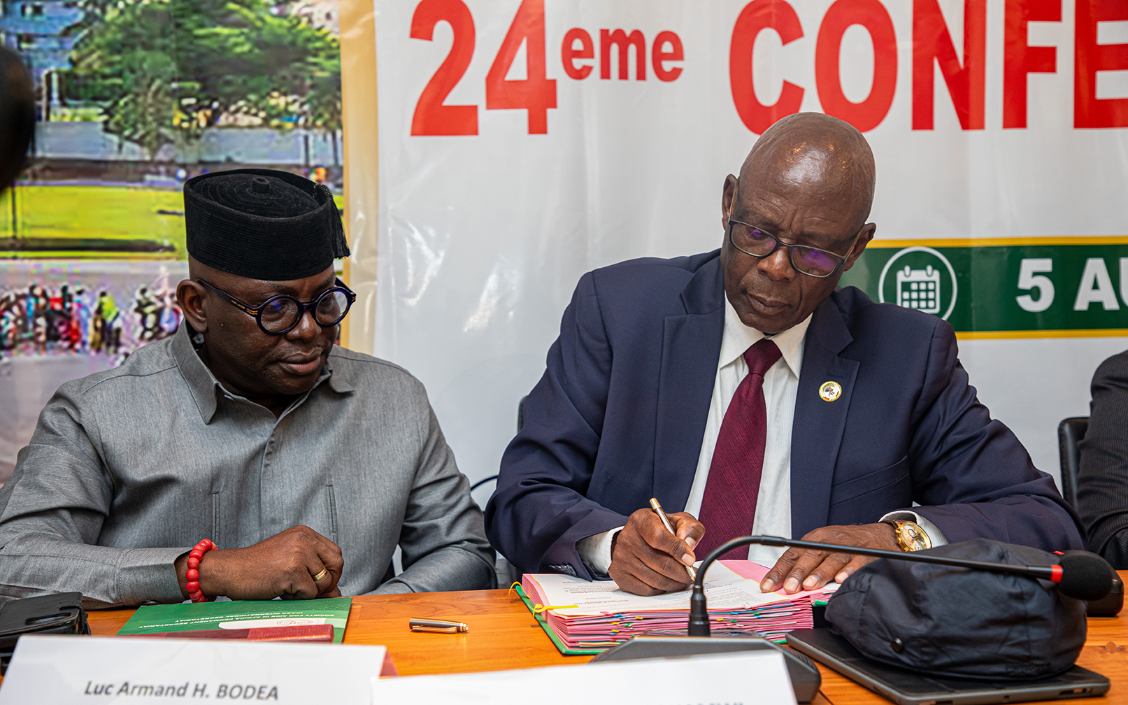 SAA President signs the ICASA 2027 MoU as Benin and the ICASA Director look on attentively